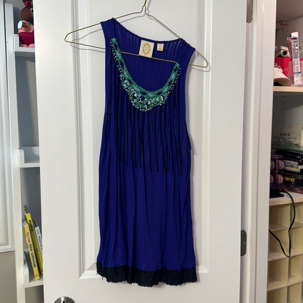 Like new, loose fitting tank with beaded neckline.